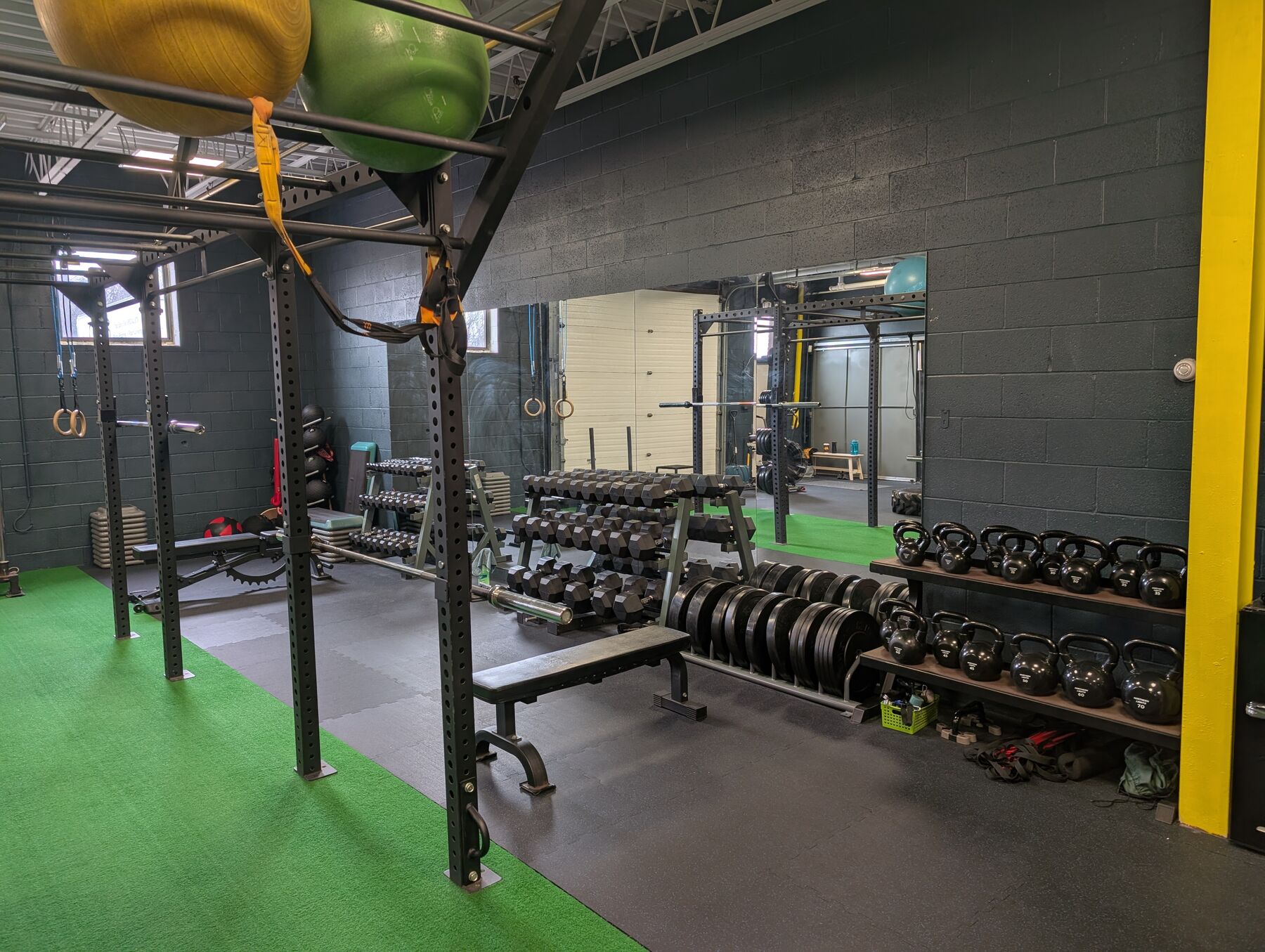 Dumbbell and weight plate racks in the strength area